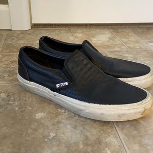 Vans black leather perforated slip ons